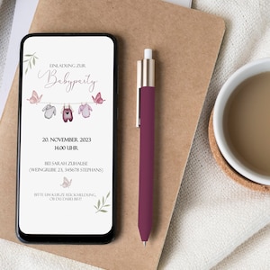May include: A digital invitation for a baby party on November 20th, 2023 at 2:00 PM. The invitation features a pink, blue, and white baby clothes hanging on a clothesline with butterflies. The text reads "Einladung zur Babyparty" and includes the date, time, and location of the party.