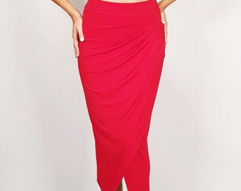 May include: A red wrap skirt with a high waist and a long, asymmetrical hemline. The skirt is made of a soft, stretchy fabric and has a flattering drape.