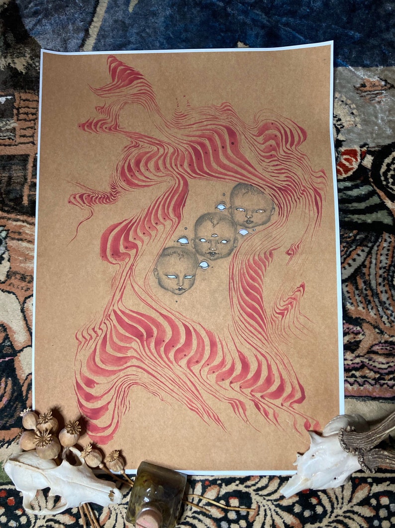May include: A brown paper print with a red and white abstract design. The design features a series of wavy lines and four faces with large eyes.