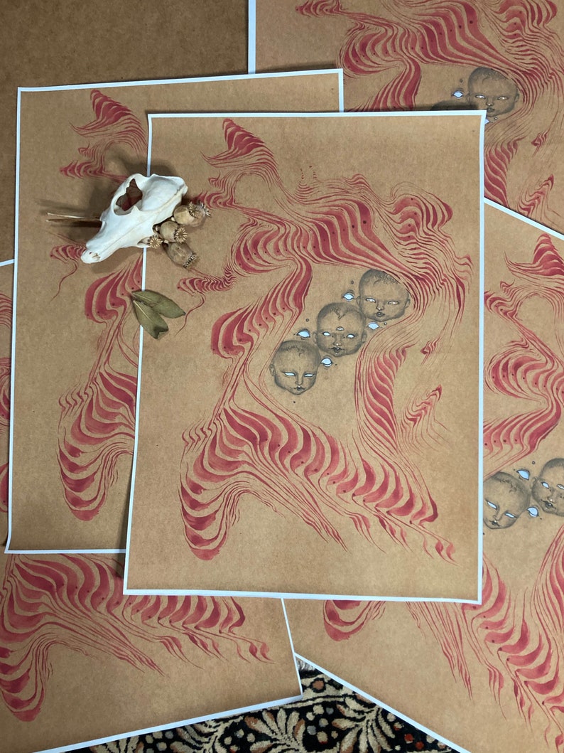 May include: A print on brown paper with a red and white swirling pattern. There are five small faces with closed eyes in the centre of the swirling pattern.