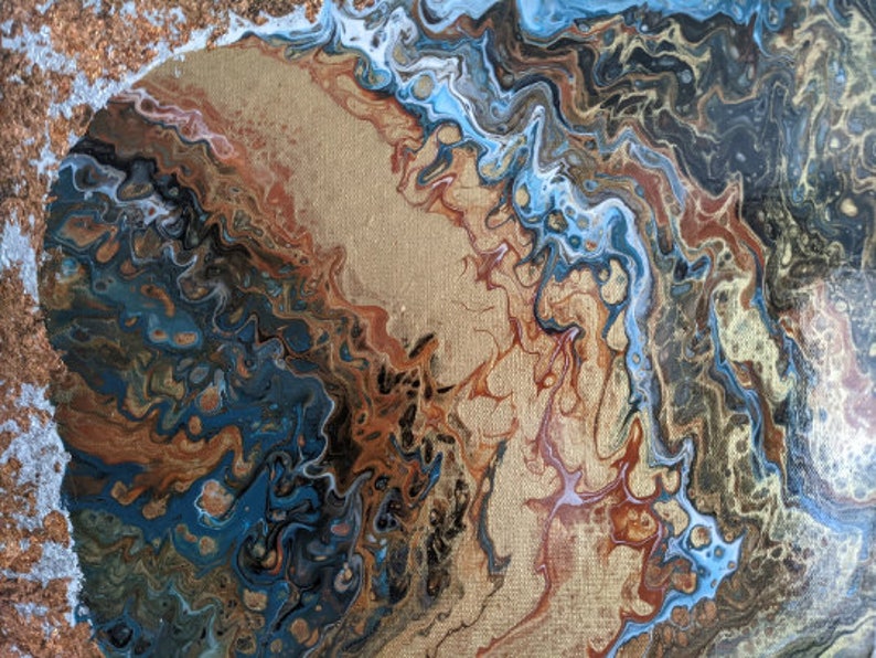 May include: Abstract painting with swirling patterns in shades of blue, brown, and gold. The painting has a textured, almost metallic look.