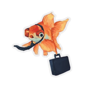 May include: A sticker featuring an orange goldfish wearing a black tie and carrying a black briefcase. The goldfish has large eyes and detailed fins. The sticker has a white border.