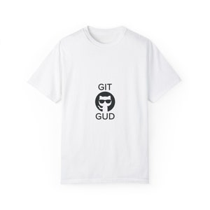 May include: White t-shirt with a black and white graphic of a cat wearing sunglasses and the text "GIT GUD".