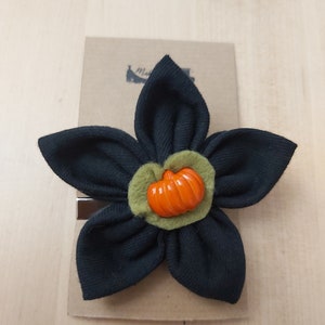 Black with pumpkin button hair flower accessory