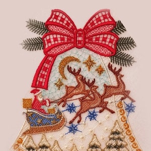 May include: Embroidered Christmas bell ornament featuring a red bow, Santa in a sleigh pulled by reindeer, and a snowy scene with pine trees.