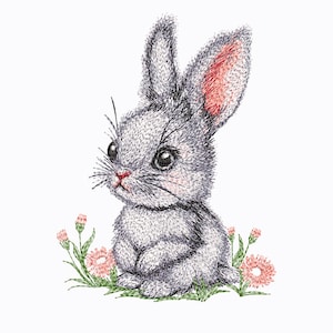 May include: A gray bunny rabbit with pink ears sits in a field of green grass and pink flowers. The bunny has a sweet expression on its face.