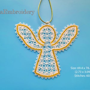 May include: White angel-shaped lace embroidery with a gold outline, hanging from a green string. The embroidery is 2.73 inches by 3.09 inches and has 6029 stitches. "Líra Embroidery" is written in the top left corner.
