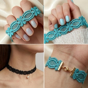 May include: A turquoise blue lace choker bracelet featuring an intricate floral pattern with a grid-like center. The piece includes gold-toned metal end caps and a lobster claw clasp. A separate black lace choker with a small white pearl pendant is shown.