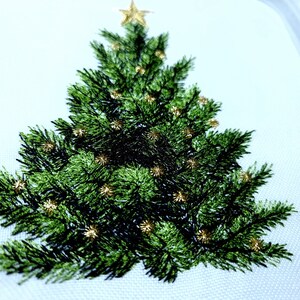 May include: Embroidered Christmas tree design with a gold star on top and gold ornaments throughout the green tree.