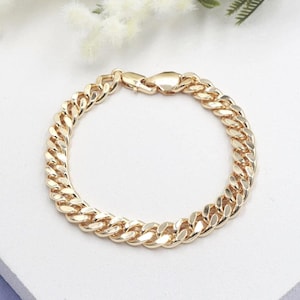 May include: A set of three ceramic nesting bowls in shades of blue, green, and white. The bowls feature a speckled glaze and a simple, modern design. The largest bowl measures approximately 6 inches in diameter.