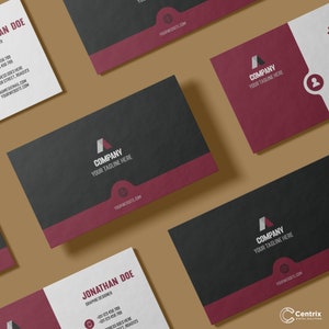 May include: A black and red business card with the text "Company" and "Your Tagline Here" in white. The card also includes a website address and a graphic design logo.