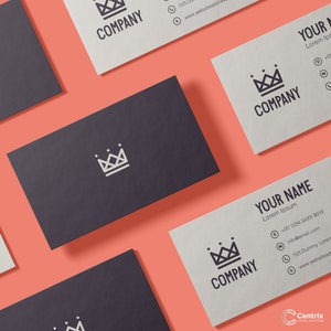May include: A set of four business cards with a crown logo and the text "COMPANY" printed on them. The cards are on a coral background.