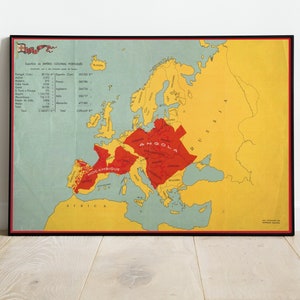 May include: A vintage map of Europe with red and yellow markings. The map shows the Portuguese colonial empire, with the text "ANGOLA", "MOÇAMBIQUE", and "AFRICA" visible. The map is framed in black.