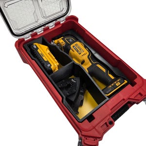 May include: A red toolbox with a clear lid, containing a yellow and black reciprocating saw, a battery, and saw blades. The tools are neatly organized within black dividers. The toolbox is designed for tool storage and transport.