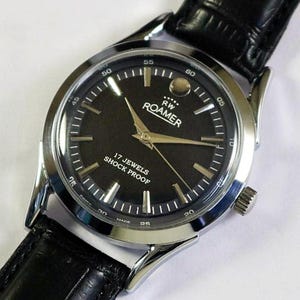 Orologio da polso da uomo vintage Roamer Swiss Made a carica manuale, quadrante nero, anse curve, cassa in acciaio inossidabile, regalo per uomo #1059-33