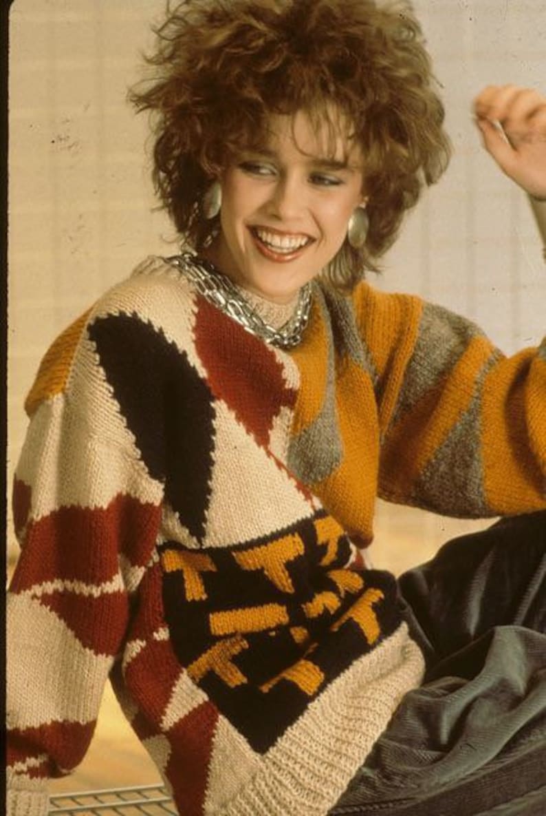 and floral appliqu\u00e9s 80s size L sweater w shoulder pads Vintage 1980s black teal and purple print sweater w sheer floral sleeves size L