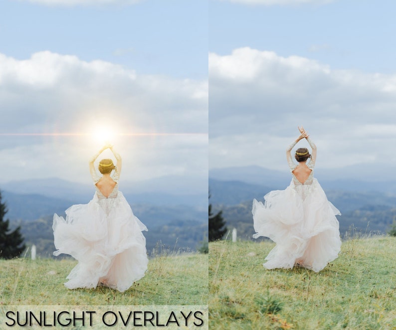 May include: A bride in a white wedding dress with her arms raised in the air, standing on a grassy hill with a mountain range in the background. The sun is shining brightly behind her, creating a lens flare effect.