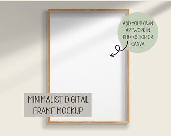 May include: A digital mockup of a minimalist wood frame with a white background. The text "ADD YOUR OWN ARTWORK IN PHOTOSHOP OR CANVA" is in a circle on the right side of the frame. The text "MINIMALIST DIGITAL FRAME MOCKUP" is below the frame.