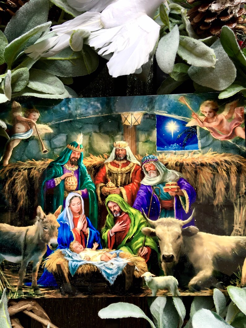 May include: A traditional Christmas nativity scene featuring a baby Jesus in a manger, surrounded by Mary, Joseph, a donkey, a cow, a sheep, and three wise men. The scene is set in a stable with straw on the floor and a star shining brightly in the night sky.