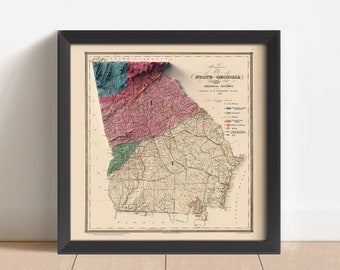 May include: A vintage map of the state of Georgia, showing geological features. The map is framed in black and has a cream-colored background. The map is divided into different colored regions, with a key to the right of the map.