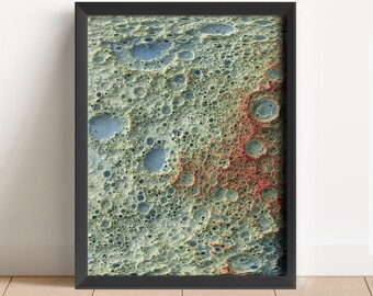 May include: A framed abstract art print featuring a close-up of a textured surface with a variety of craters in shades of green, blue, and red.