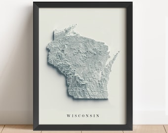 Puede incluir: Una impresión enmarcada de un mapa topográfico 3D de Wisconsin. El mapa está en tonos de gris y blanco, con el nombre del estado impreso debajo.