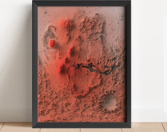 May include: A framed print of an abstract landscape in shades of red and black. The landscape appears to be a close-up of a rocky, mountainous terrain with a red hue.