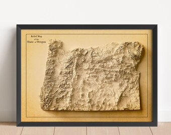 Puede incluir: Un mapa en relieve de estilo vintage del estado de Oregón, enmarcado en negro. El mapa muestra la topografía del estado con áreas elevadas que representan montañas y valles.