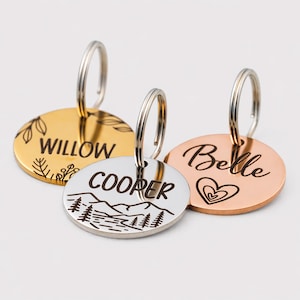 Up close photo of three laser engraved horse bridle tags with varying color (silver, gold & rose gold) and each lasered with a unique design.