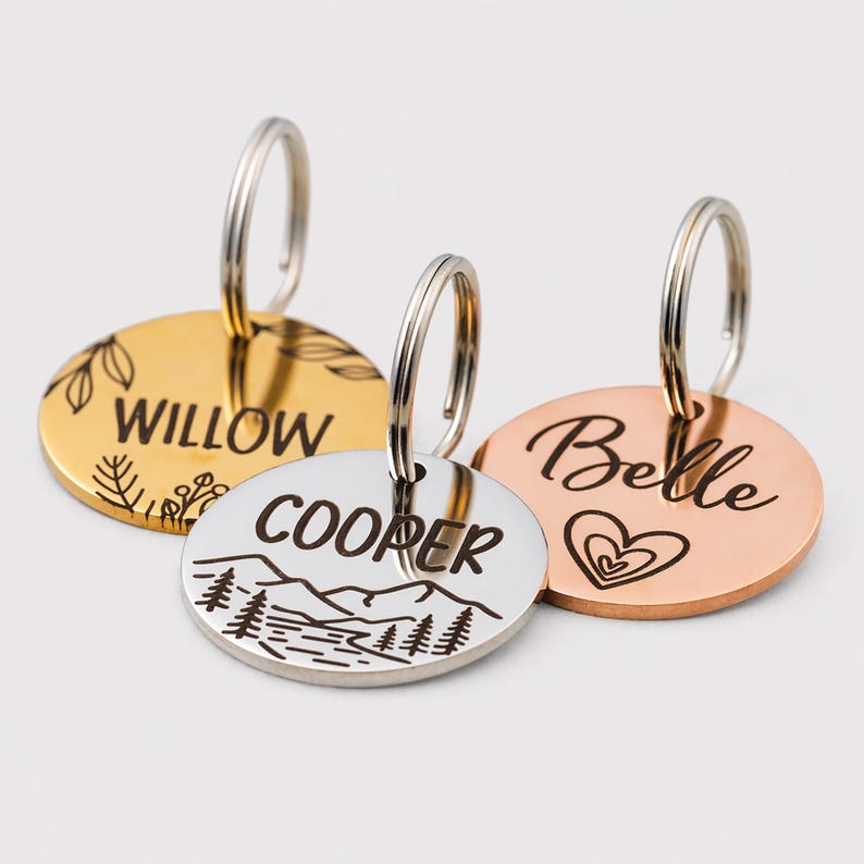 Up close photo of three laser engraved horse bridle tags with varying color (silver, gold & rose gold) and each lasered with a unique design.