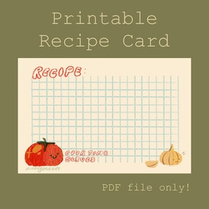May include: Printable recipe card with a grid background, featuring a red tomato and a garlic bulb illustration. The card includes the text "Recipe," "Cook Time," and "Serves." The words "Printable Recipe Card" are at the top.