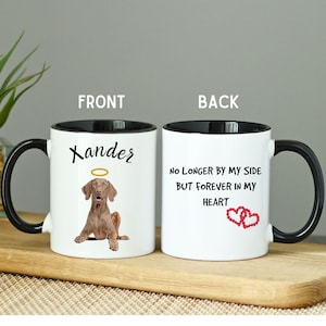 May include: White ceramic mug with a black rim and handle. The front of the mug has a brown dog with a halo above its head and the name "Xander" printed in black. The back of the mug has the text "No Longer By My Side But Forever In My Heart" printed in black with two red hearts.
