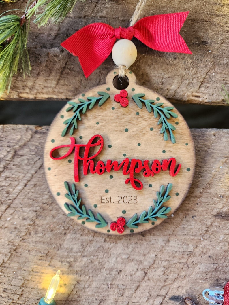 A wooden ornament with text on it