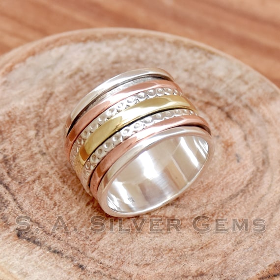 Spin Ring with Three Gold Spinning Bands Hammered Antiqued Sterling Silver Spin Ring with Three Gold Spinning Bands Hammered Antiqued Sterling Silver