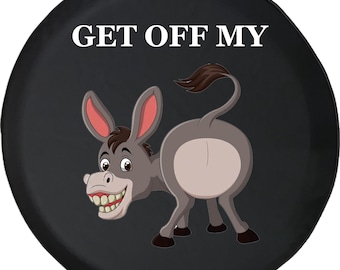 May include: Black spare tyre cover with a cartoon donkey grinning. The text "GET OFF MY" is printed in white. The donkey is grey with pink ears and a brown tail. A humorous design.