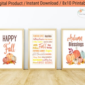 Puede incluir: Tres carteles imprimibles de 20,3 x 25,4 cm con temática otoñal con ilustraciones de acuarela de calabazas y hojas de otoño. Los carteles presentan el texto "Happy Fall", "Pumpkin Spice Hayrides, Falling Leaves, Crisp Breeze, Chilly Nights, Warm Cider, Apple Picking, Football Games, Bonfires, Hot Chocolate, Smores, Fuzzy Socks, Cozy Sweaters, Warm Blankets, Crackling Fires, Autumn Harvest Blessings" y "Autumn Blessings".