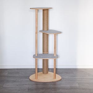 May include: A wooden cat tree with a sisal scratching post and multiple platforms covered in gray felt. The cat tree has a rounded base and is designed for cats to climb and play.