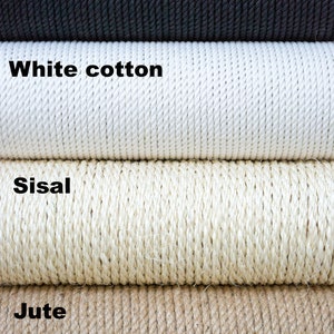 Puede incluir: Primer plano de cuatro tipos diferentes de cuerda: algod&oacute;n negro, algod&oacute;n blanco, sisal y yute. La cuerda est&aacute; enrollada y apilada una encima de la otra. El texto "Buda Pets own space" es visible en la esquina inferior derecha.