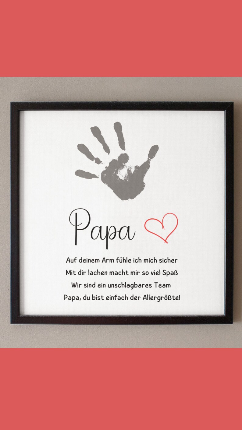 May include: Framed print with a gray handprint, the word "Papa", and a red heart. Below, text in black script reads, "On your arm I feel safe, laughing with you is so much fun, we are an unbeatable team, Papa, you are simply the greatest!"