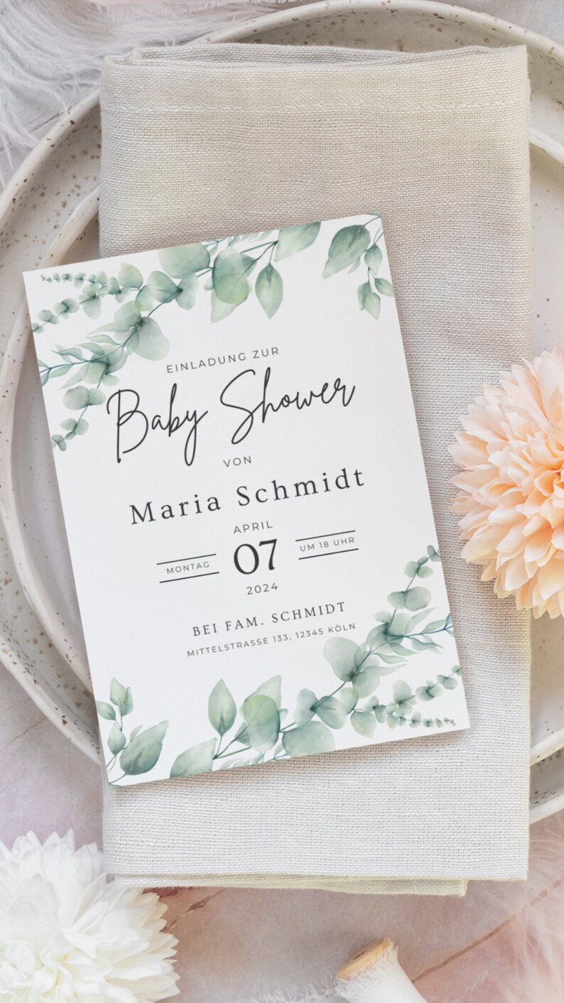 May include: A baby shower invitation with a watercolor eucalyptus design. The invitation includes the text "Baby Shower" and details for Maria Schmidt's baby shower on April 7, 2024, at 6 PM. The invitation is on a white background.