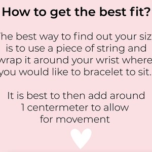 May include: Pink background with white text explaining how to measure your wrist for the best fit for a bracelet. The text says: "How to get the best fit? The best way to find out your size is to use a piece of string and wrap it around your wrist where you would like to bracelet to sit. It is best to then add around 1 centimeter to allow for movement."