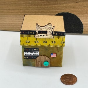 Miniature Mouse House~Sewing Shop~77 Cougar Gold Court~Sewing table, a roll and cheese