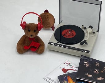 Osito de peluche musical en miniatura