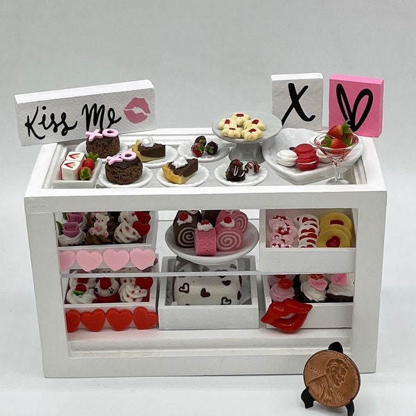 Miniature Valentine's cake, cupcakes, cookies and desserts.