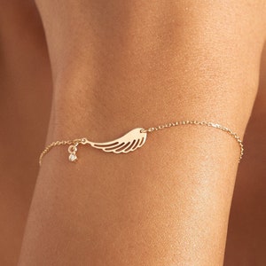 Gold store angel bracelet