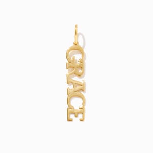 May include: Gold charm necklace with the name "GRACE" spelled vertically.