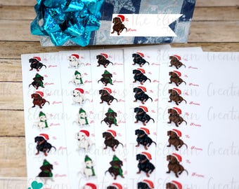 May include: A sheet of white gift tags with a dachshund wearing a Santa hat and scarf. The tags have the words "To" and "From" printed on them.