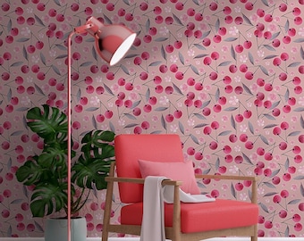 May include: A pink room with a cherry patterned wallpaper, a red armchair, a floor lamp, and a potted plant. The room has an arched doorway leading to another pink room.
