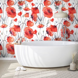May include: A white bathroom with a freestanding bath and wallpaper featuring a watercolour pattern of red poppies on a white background.