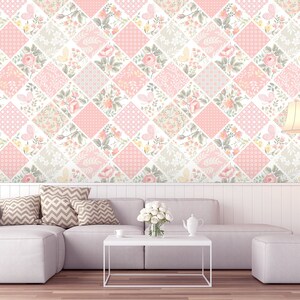 May include: A pink and white floral wallpaper with a diamond pattern. The wallpaper is in a living room with a white sofa, a white coffee table, and a white lamp.